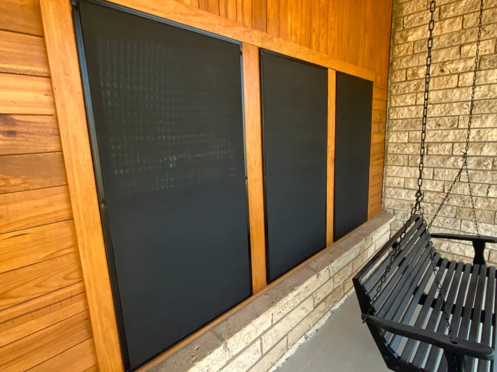 A dark window screen.