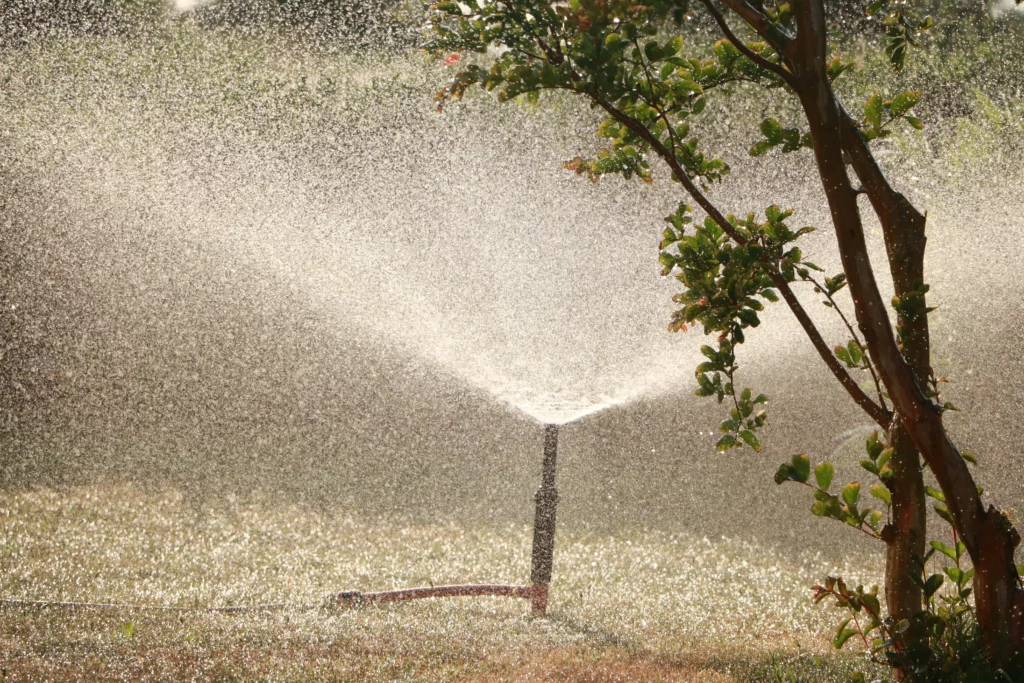 A water spray coming out of a nozzle used for pressure washing.