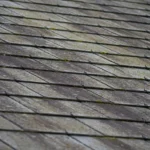 Roof tiles that are darkened due to dirt build up.