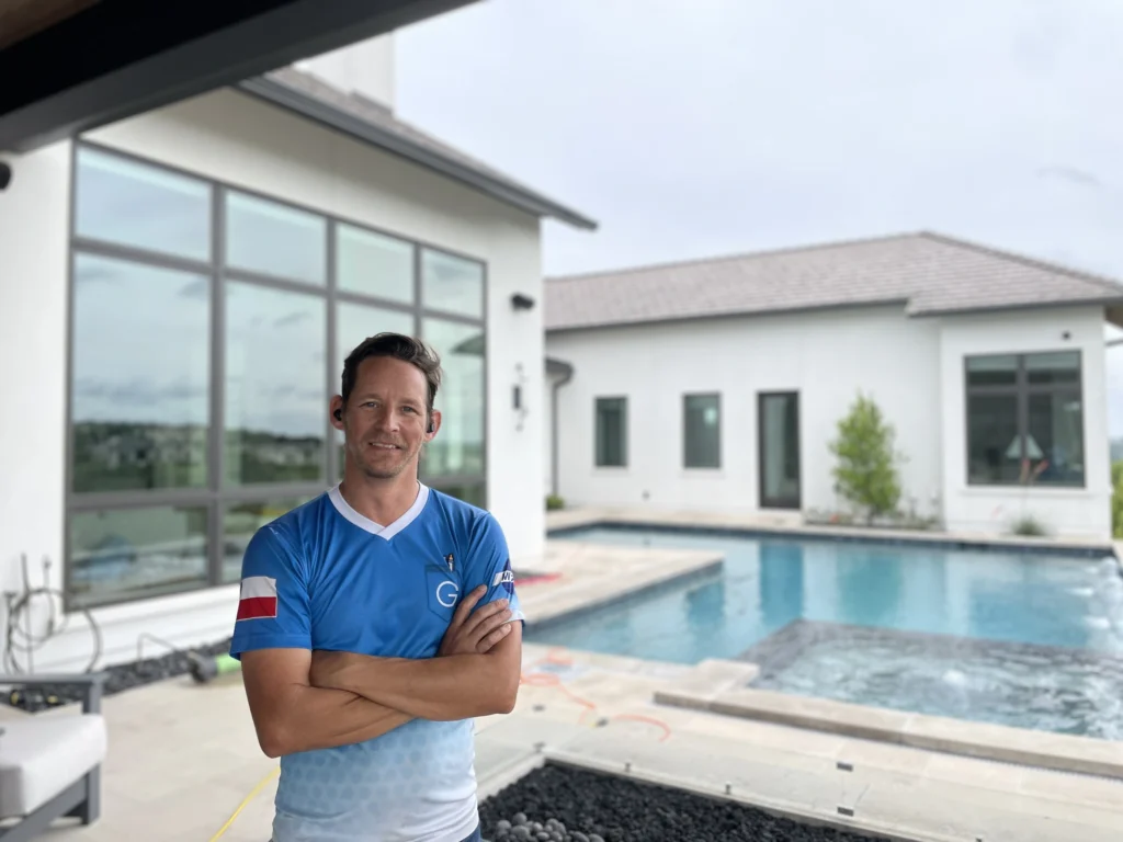 Man Standing in Front of Pool