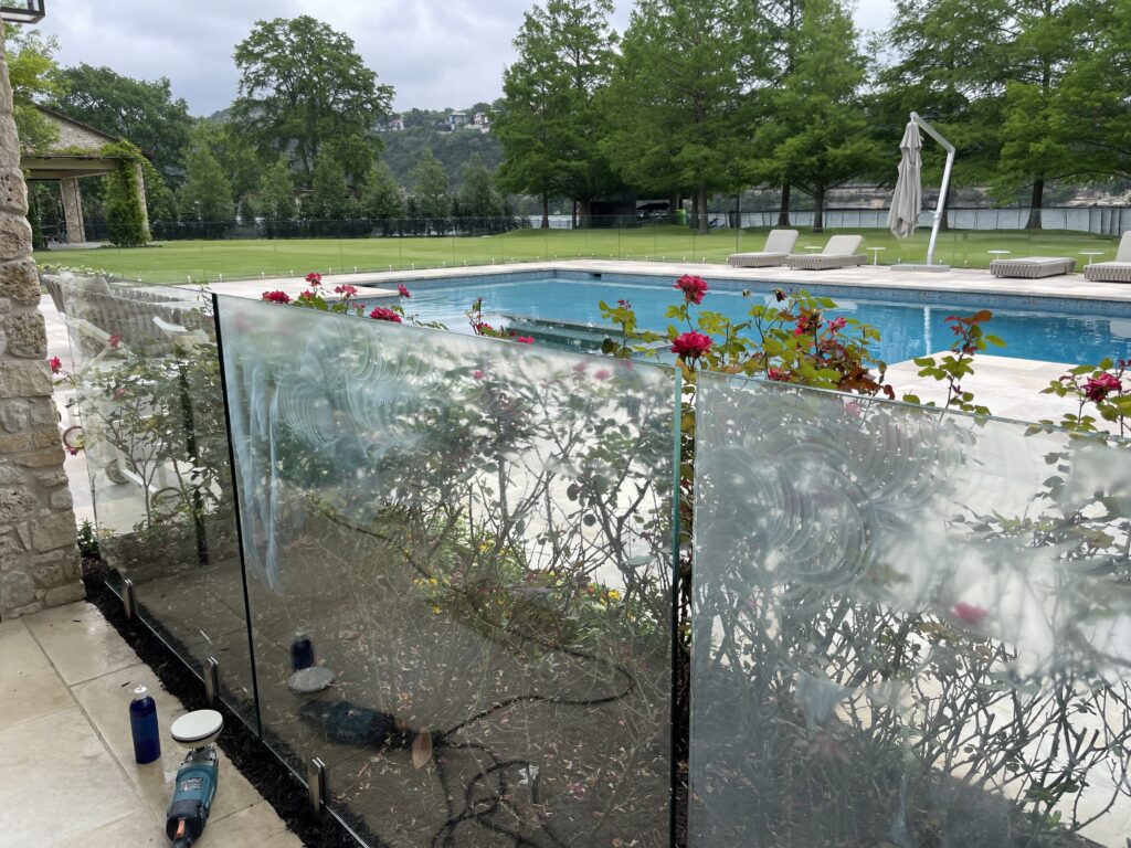 Shiny Clean Glass Barrier in Backyard